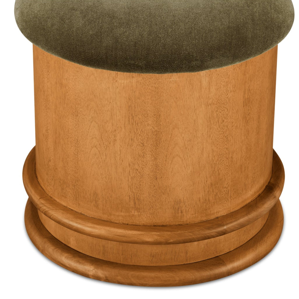 Wooden pedestal with green cushion top on a white background